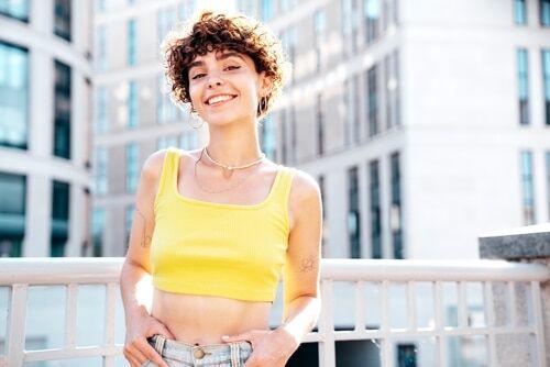 Confident girl in a yellow top.